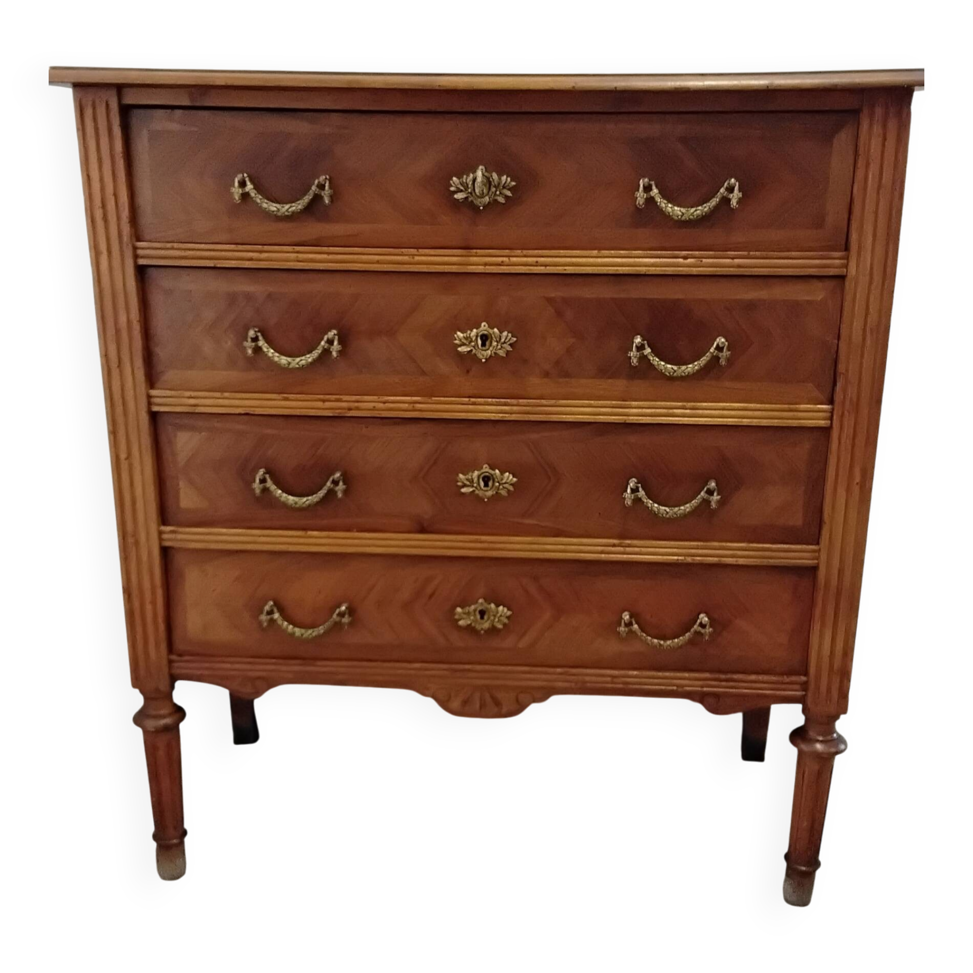 Antique marquetry commode in the Louis XVI style.