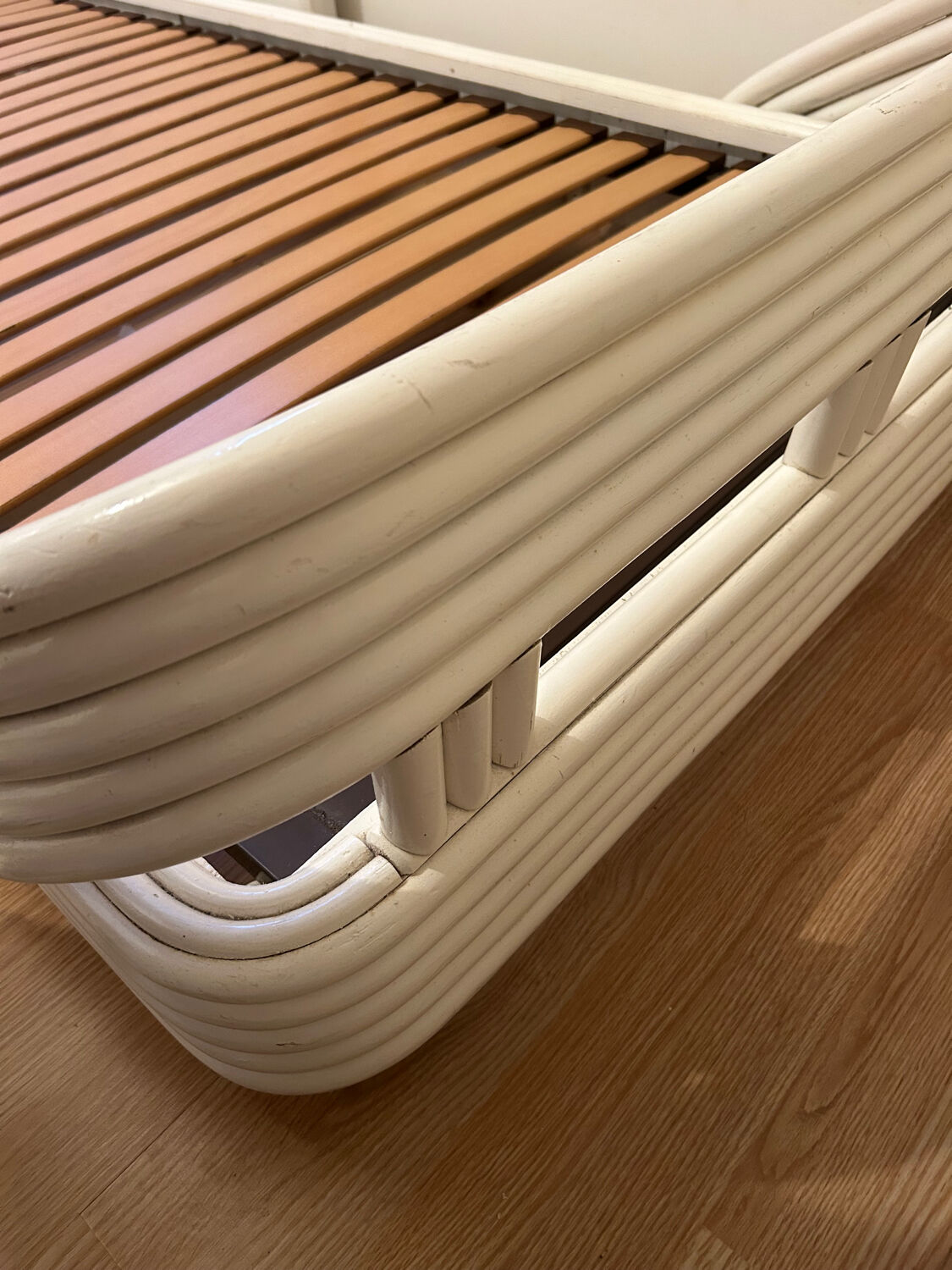 Vintage white rattan bed from the 1960s.