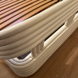 Vintage white rattan bed from the 1960s.