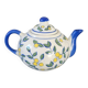Blue teapot and yellow fruits