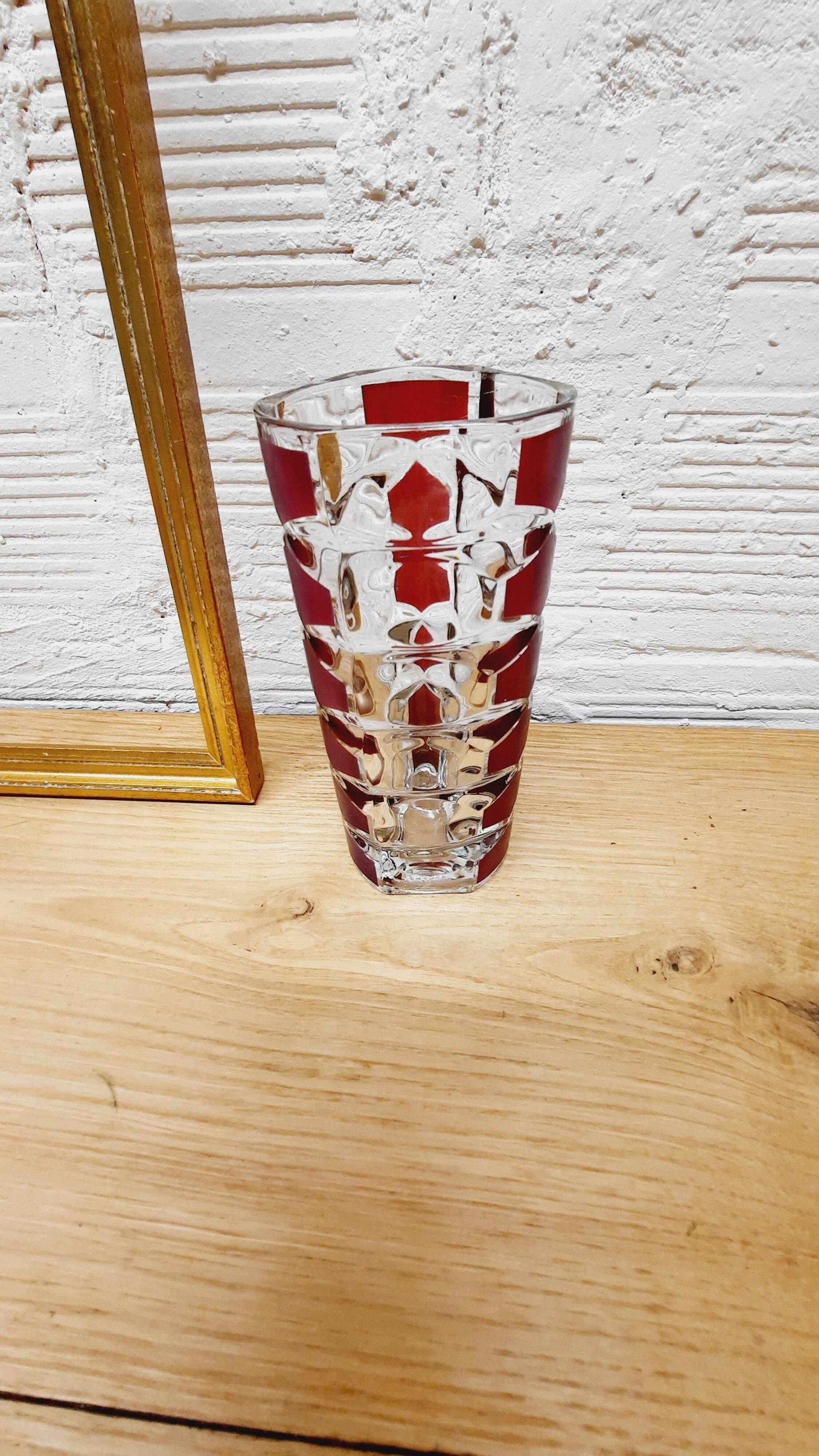 Glass vase with colored facets