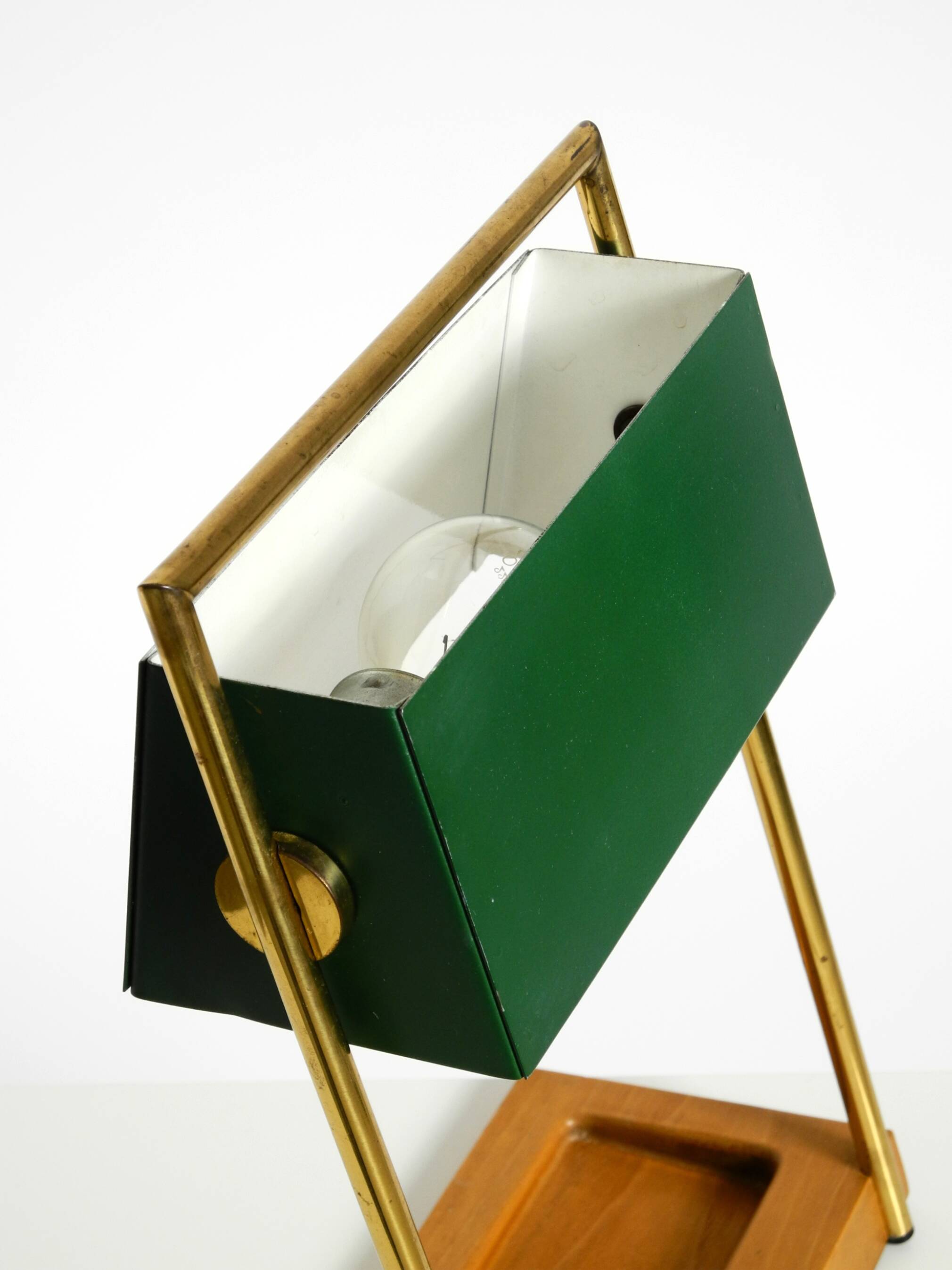 1960s Temde table lamp with a brass frame, teak base, and green lampshade