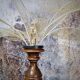 Table lamp, turned wooden foot, 8 rattan petals and golden mesh