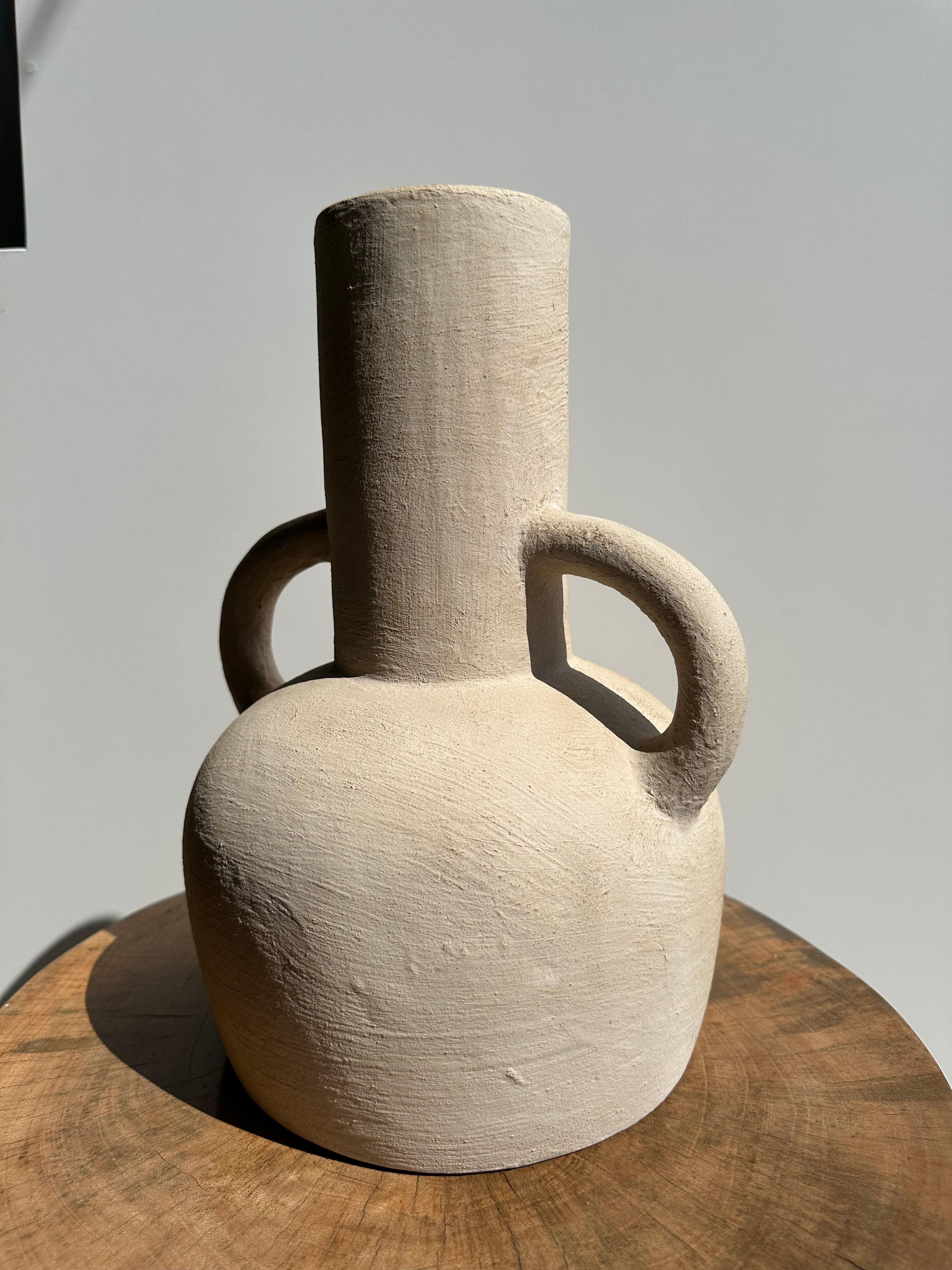 Handmade terracotta vase painted in beige with double handles h:32 d:25