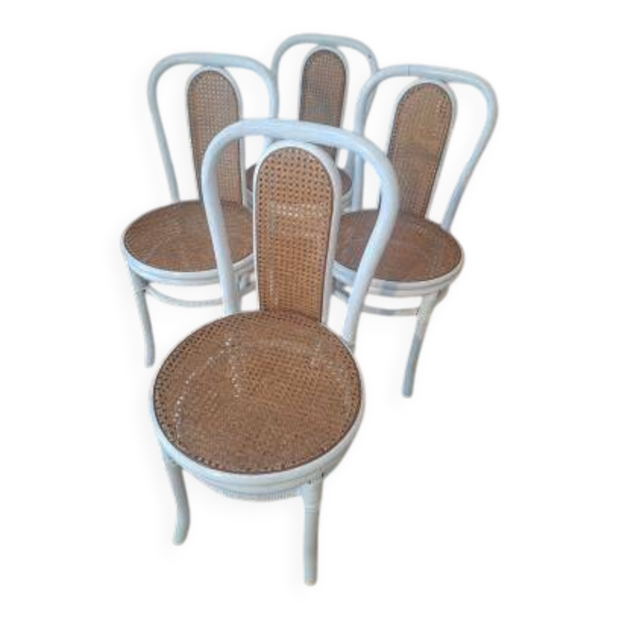 4 white rattan and cane chairs