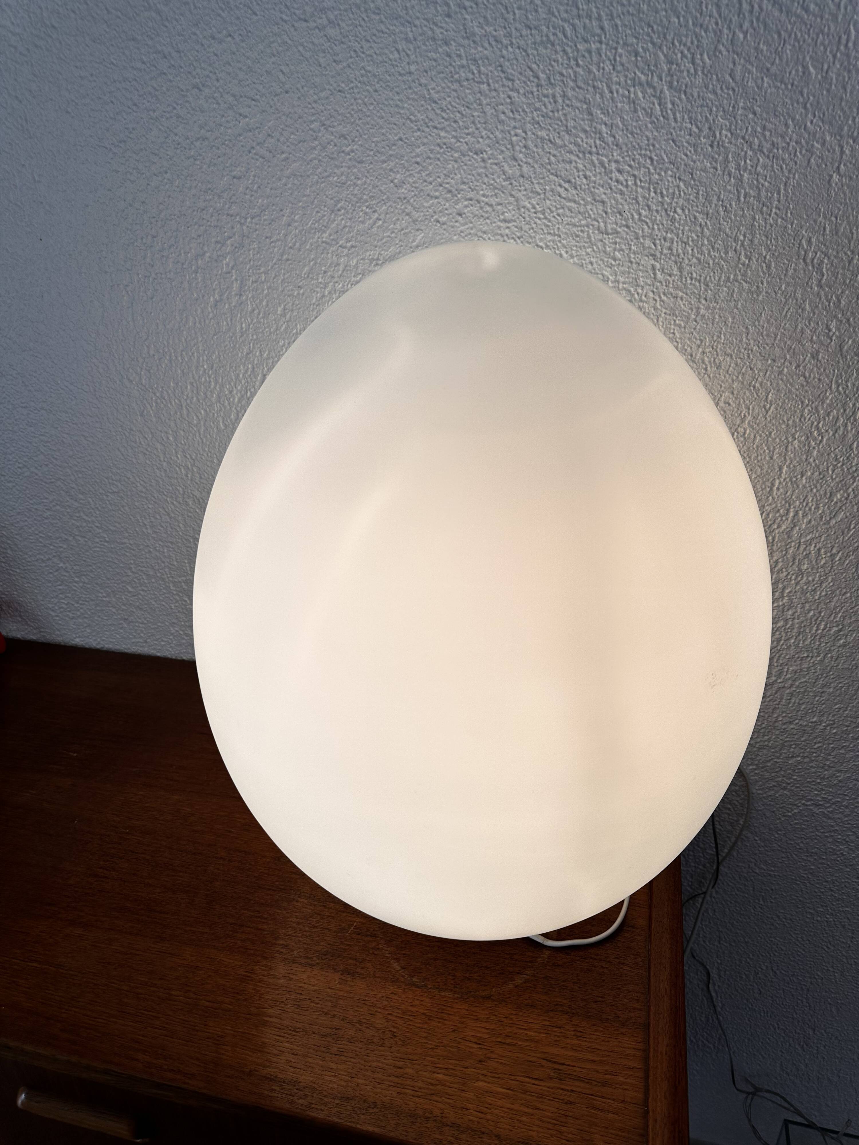 Two opal glass egg lamps