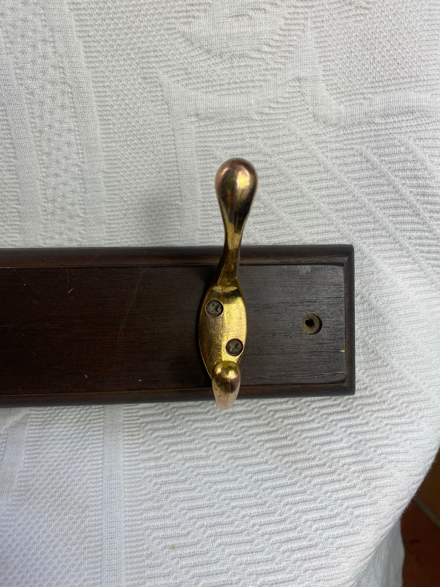 Wooden coat rack with double brass hooks