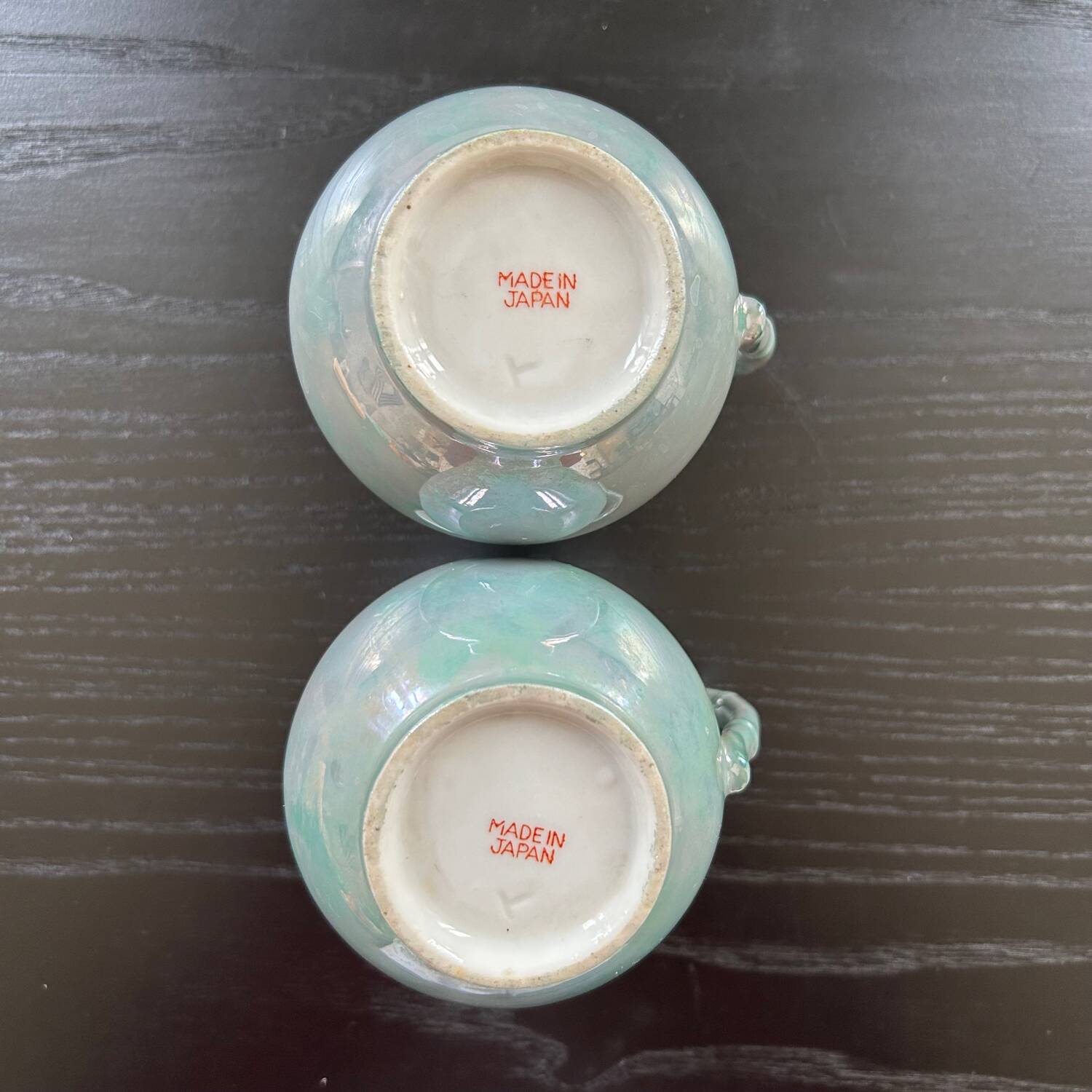 Pair of iridescent blue pitchers