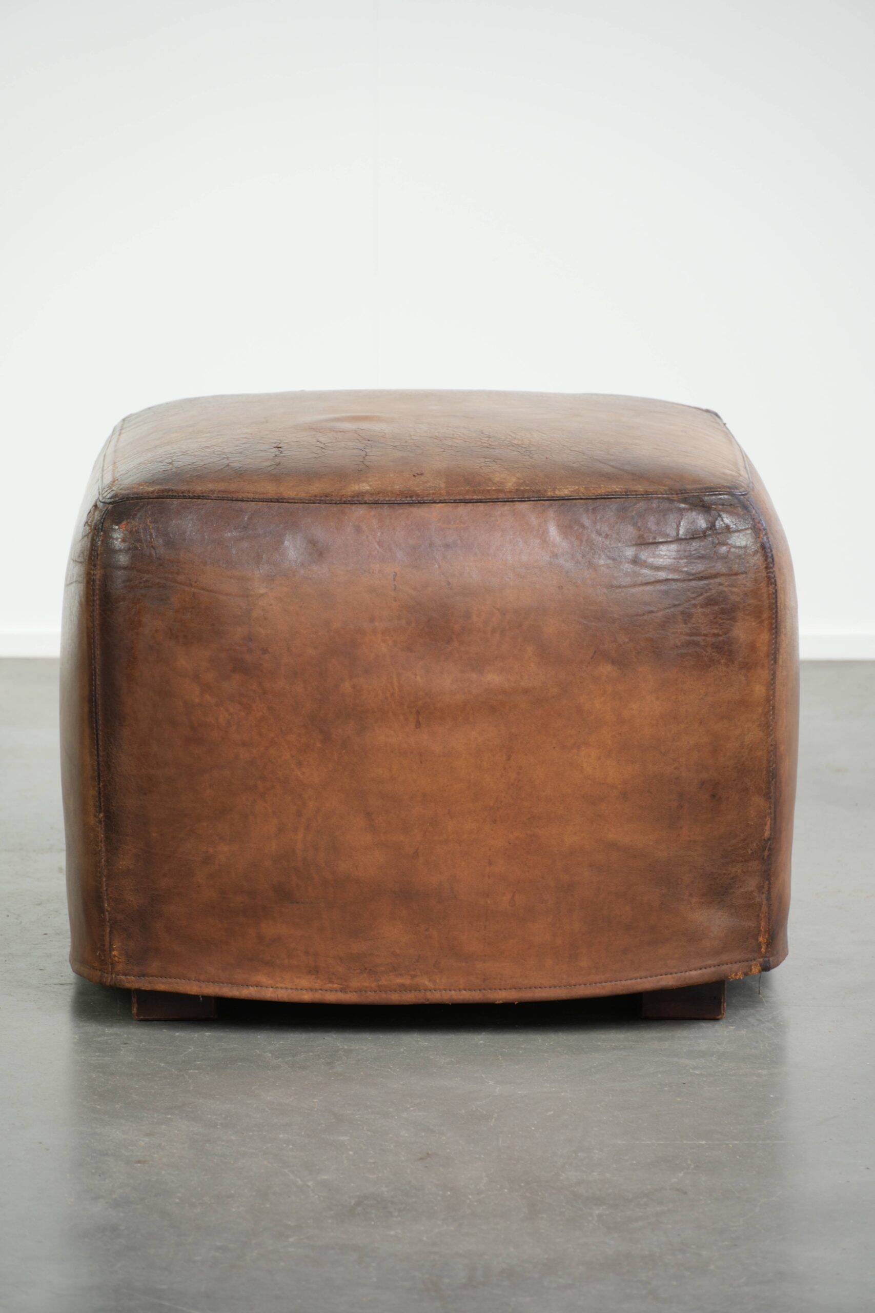 Sheepskin design ottoman with a very beautiful patina and stunning colours