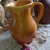 Set of three glazed stoneware pitchers