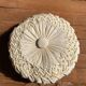 Round yoga cushion made of off-white fabric