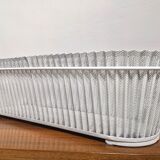 White perforated sheet metal planter by Mathieu Mategot