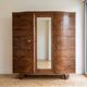Vintage 1950s wardrobe in wood with a rosewood effect.