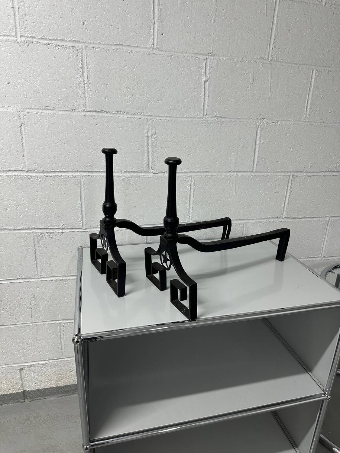 Pair of designer cast iron andirons