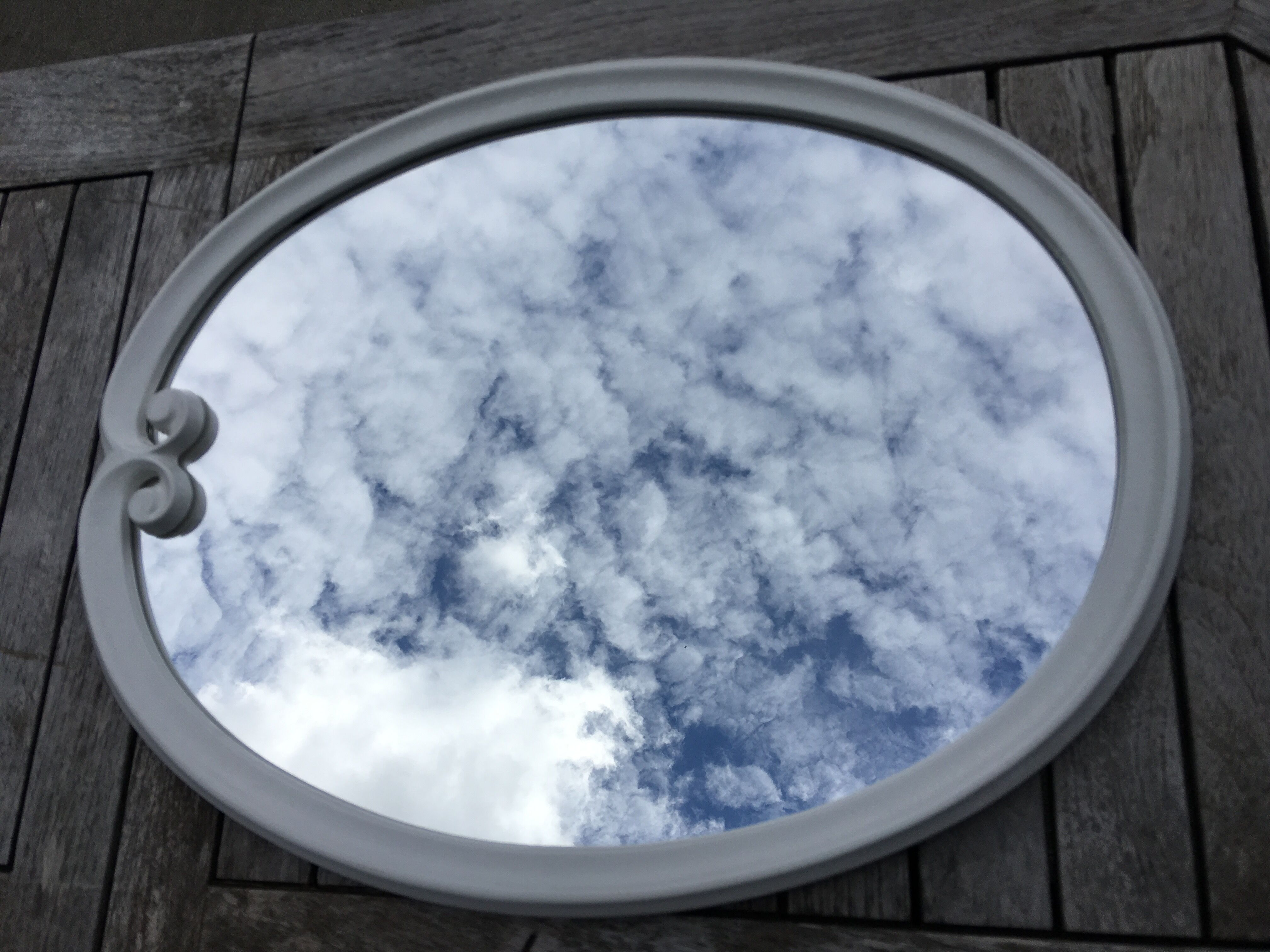 Oval mirror enamelled cast iron and its hook, circa 1950 39x49cm