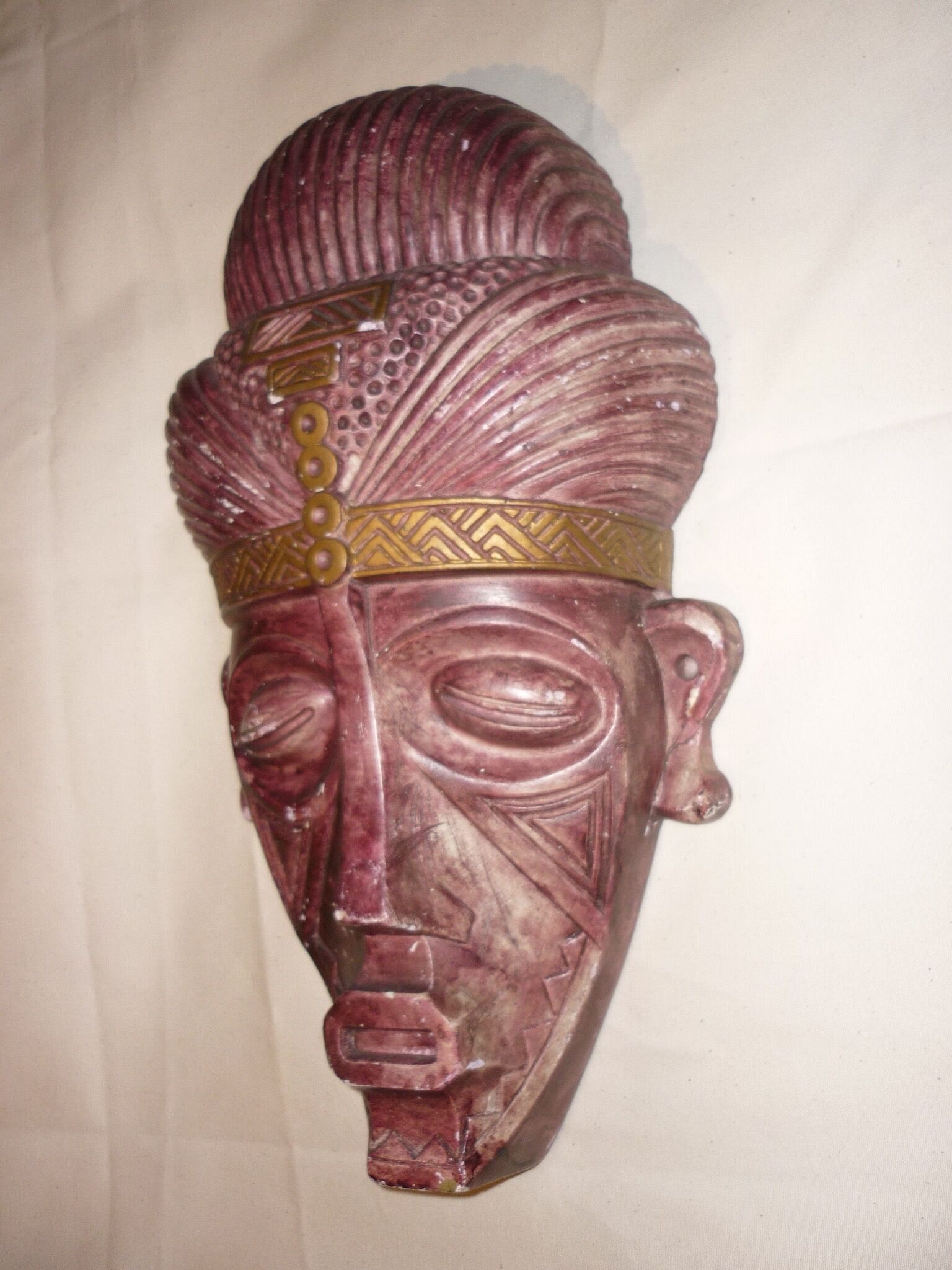African mask in earth