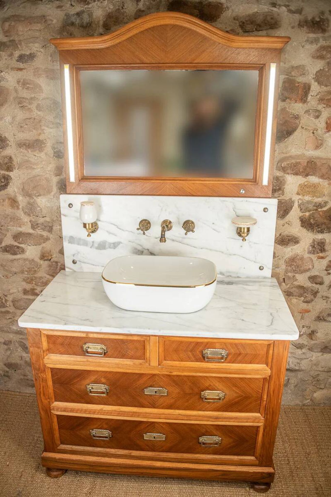 Antique washbasin cabinet from 1928 in wood and marble with illuminating mirror.