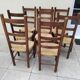 8 vintage straw chairs in the style of Charlotte Perriand.