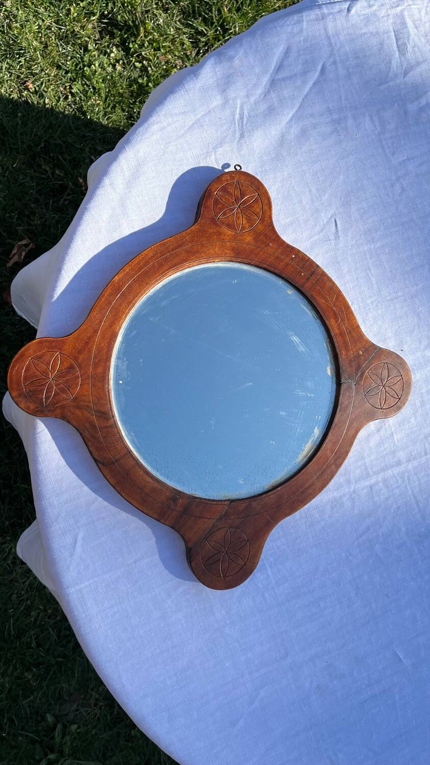 Wooden mirror with vintage rosettes