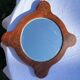 Wooden mirror with vintage rosettes