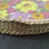 Top of the 60s in rattan braid wood bottom covered with a plastic with pink and yellow flower