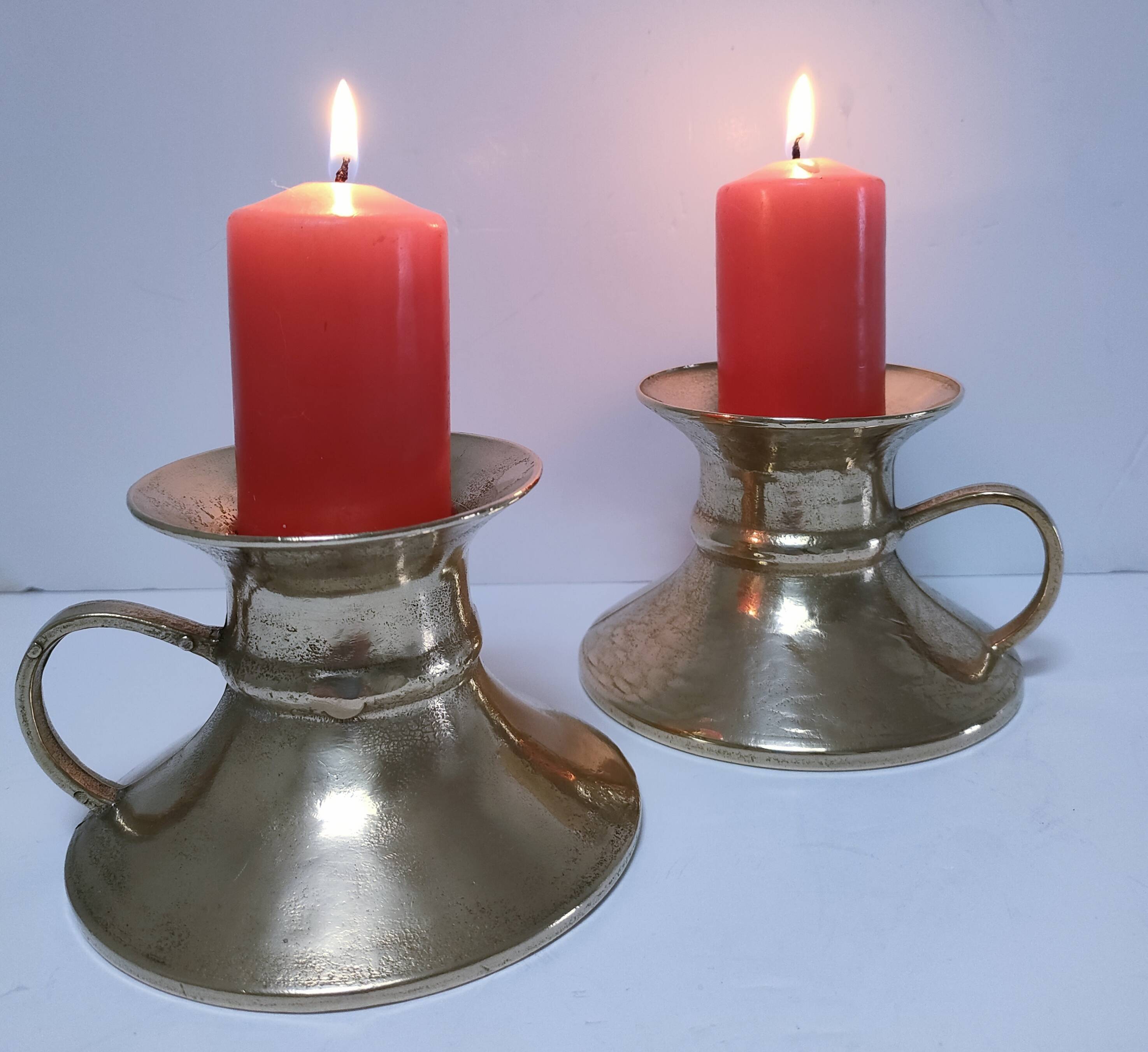 Pair of vintage solid brass hand candlesticks