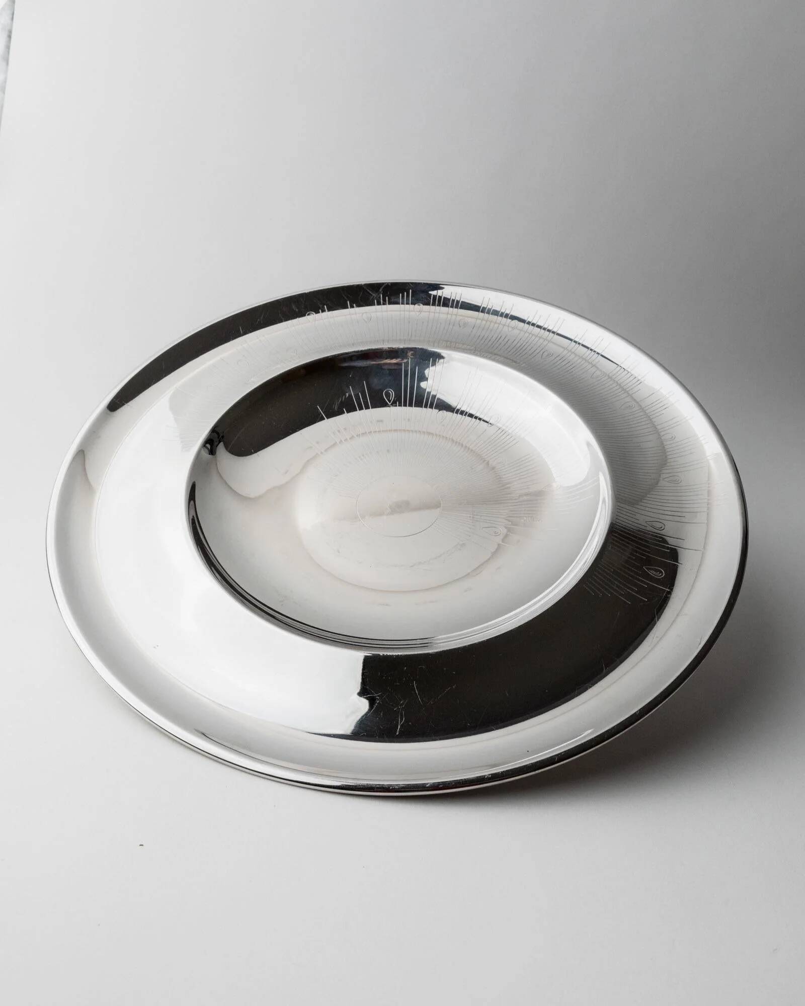 Vintage stainless steel bowl from the 1980s, polished metal with a finely textured surface, timeless elegant design, retro table decoration, noble gift idea.