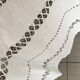 Net-style embroidered cotton tablecloth.