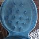 Blue heater with fringed medallion shape