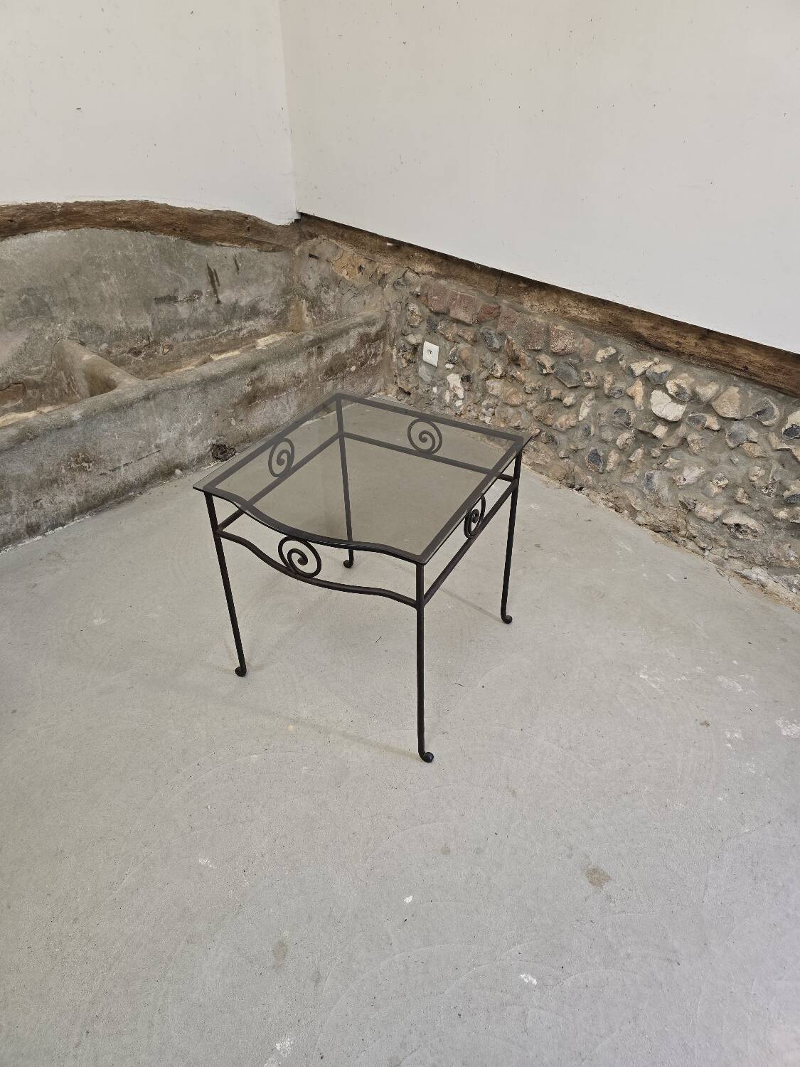 Small side table in wrought iron and smoked glass