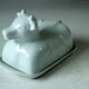 White ceramic butter dish in the shape of a cow, vintage