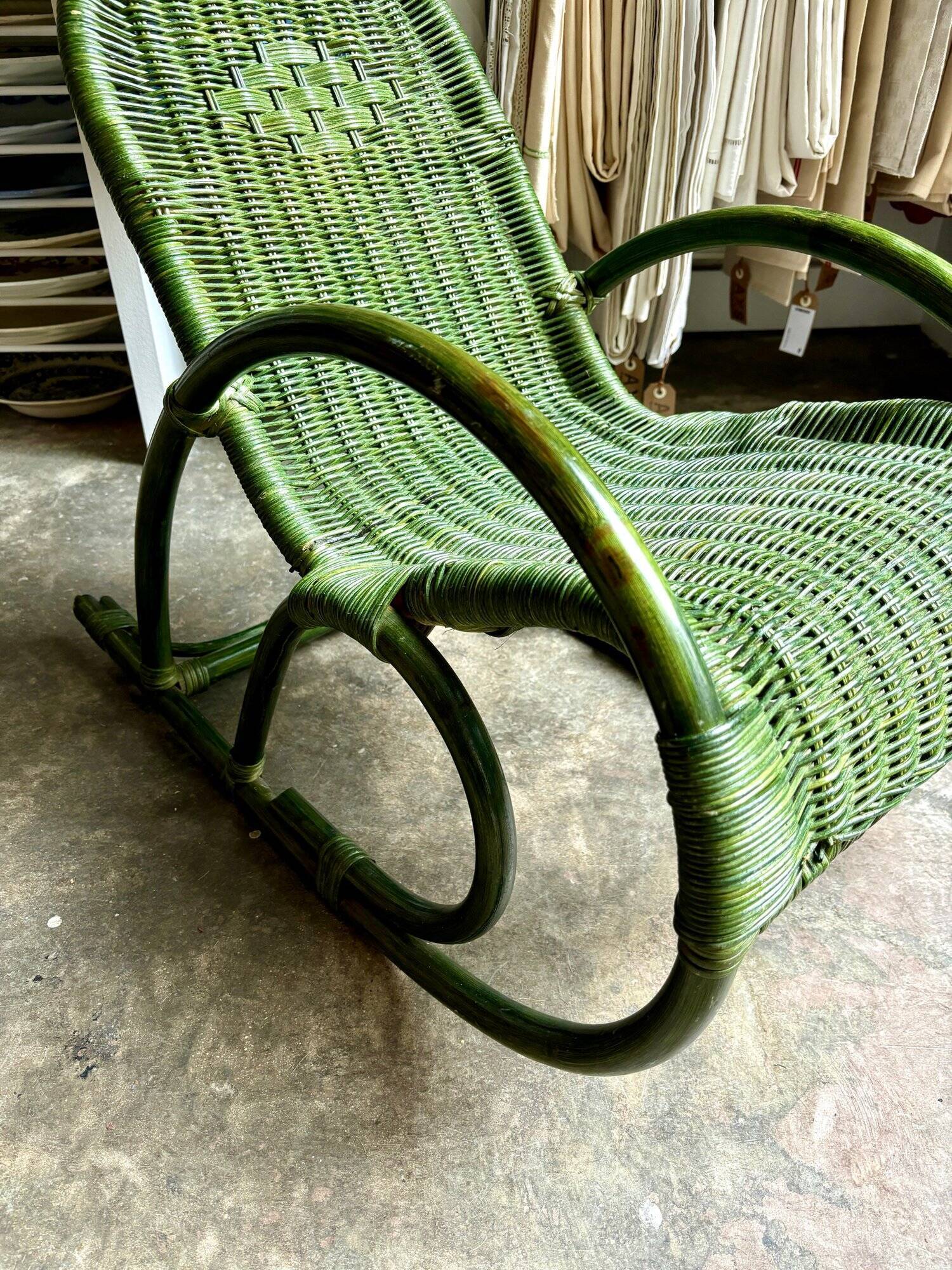 Children's rocking chair in woven wicker and green rattan