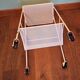 Perforated white metal serving trolley