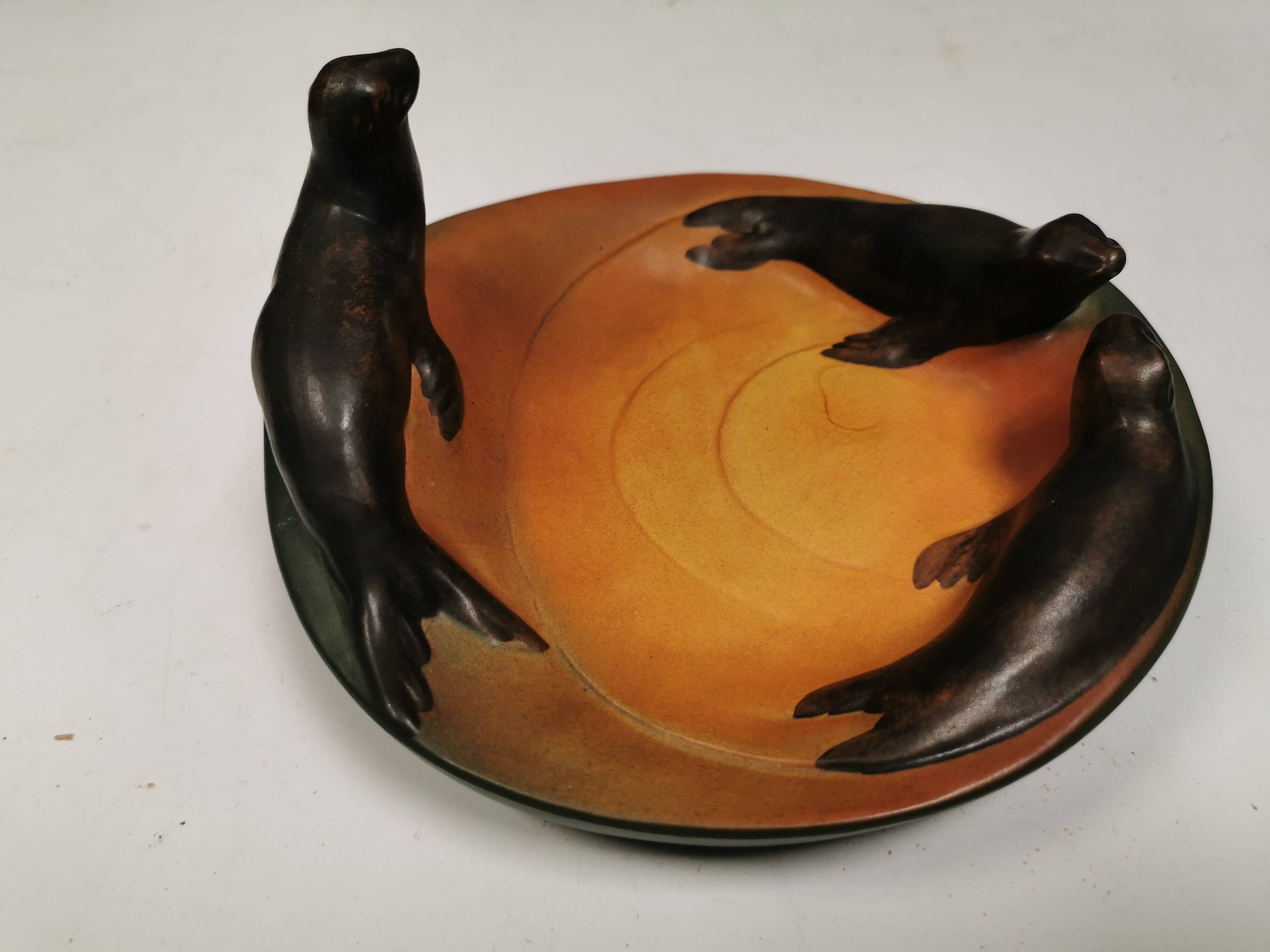 Dish with sea lions hand painted by Ipsen's widow, Denmark 1930s.