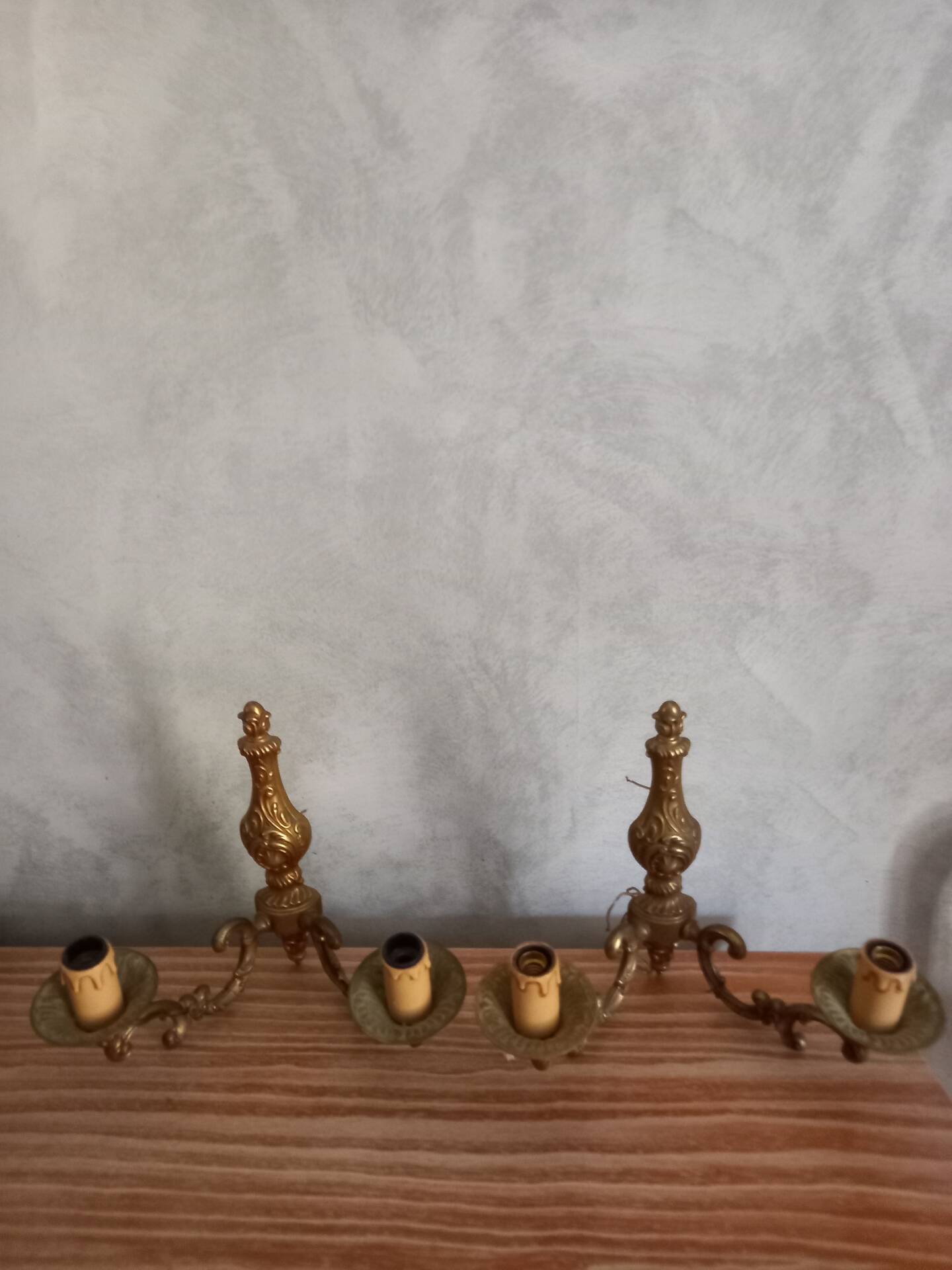 Old pairs of bronze wall sconces