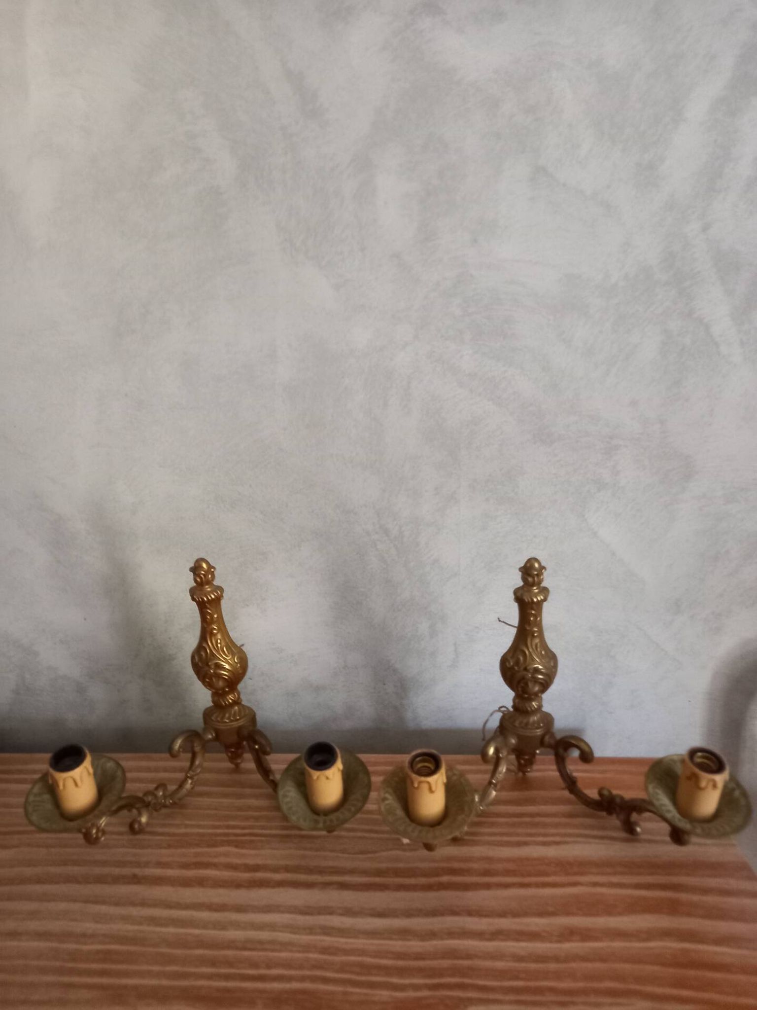 Old pairs of bronze wall sconces