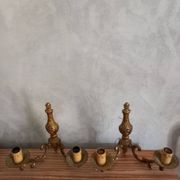 Old pairs of bronze wall sconces
