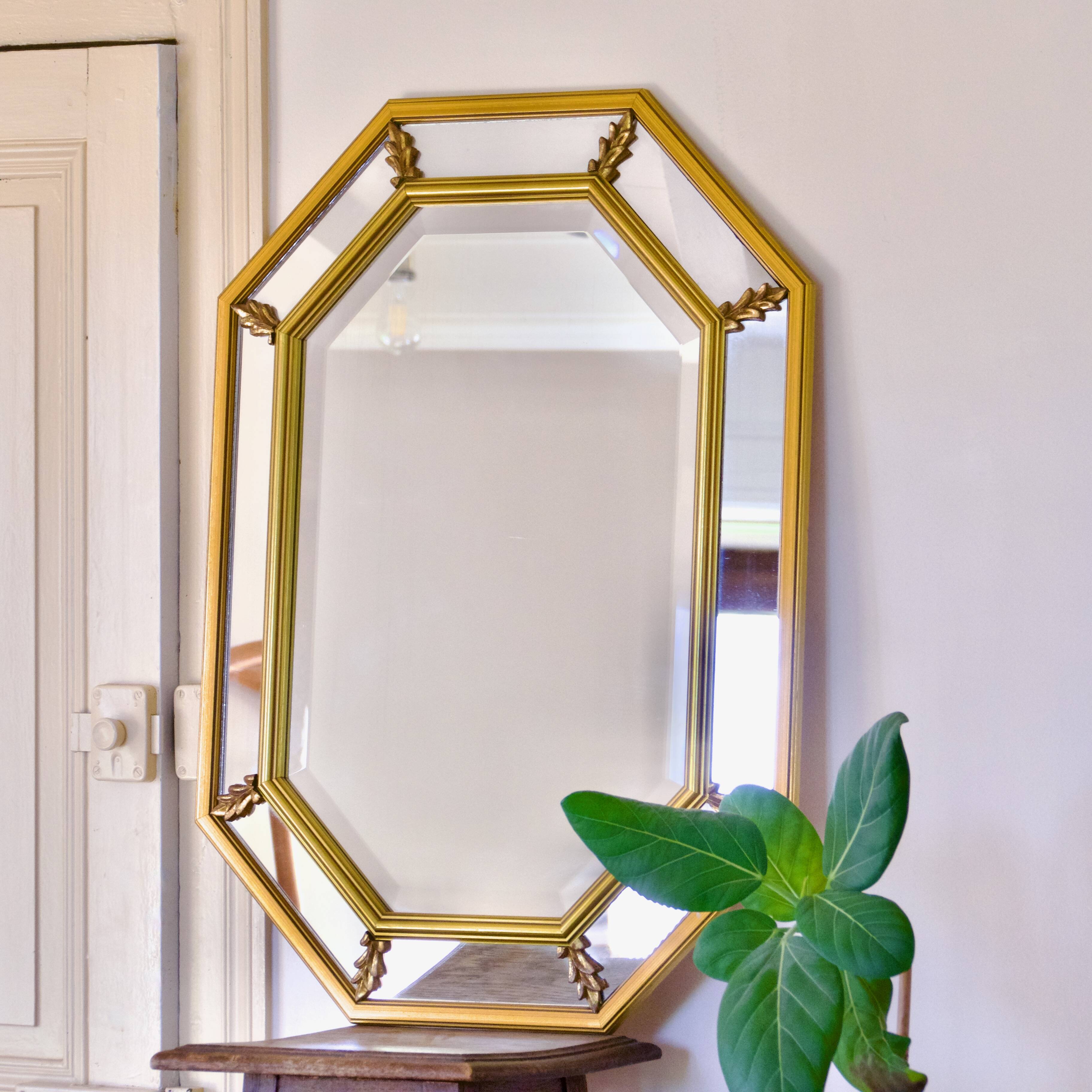 Large beveled, neoclassical mirror with gilded wood edges