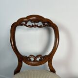 Pair of Victorian English chairs known as balloon chairs in solid mahogany.