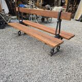 Antique double garden bench from the city of Paris in cast iron and wood