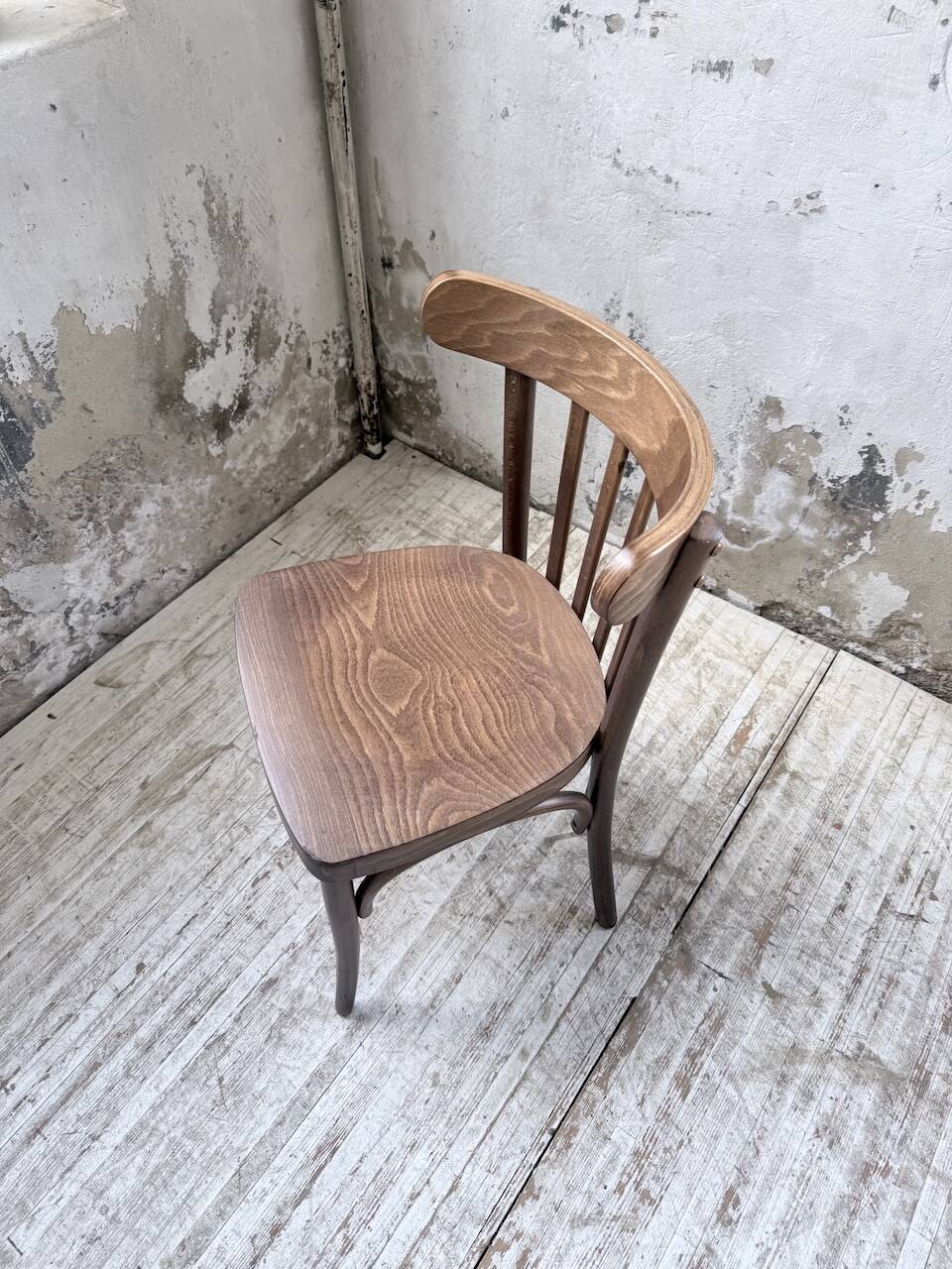 Set of 14 walnut bistro chairs.