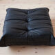 Armchair and ottoman in black leather model designed by Michel Ducaroy 1973