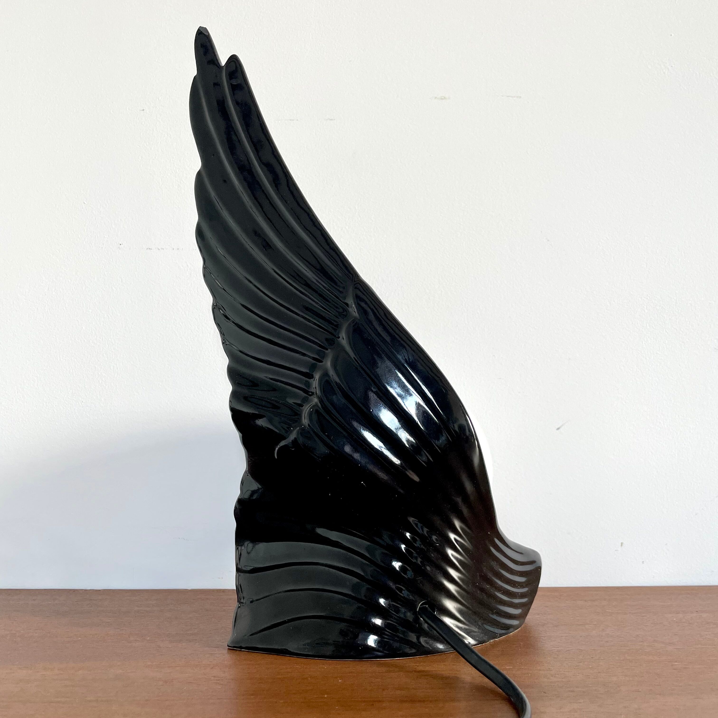 Ceramic wing and globe lamp