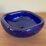 Empty blue bubbled glass pocket