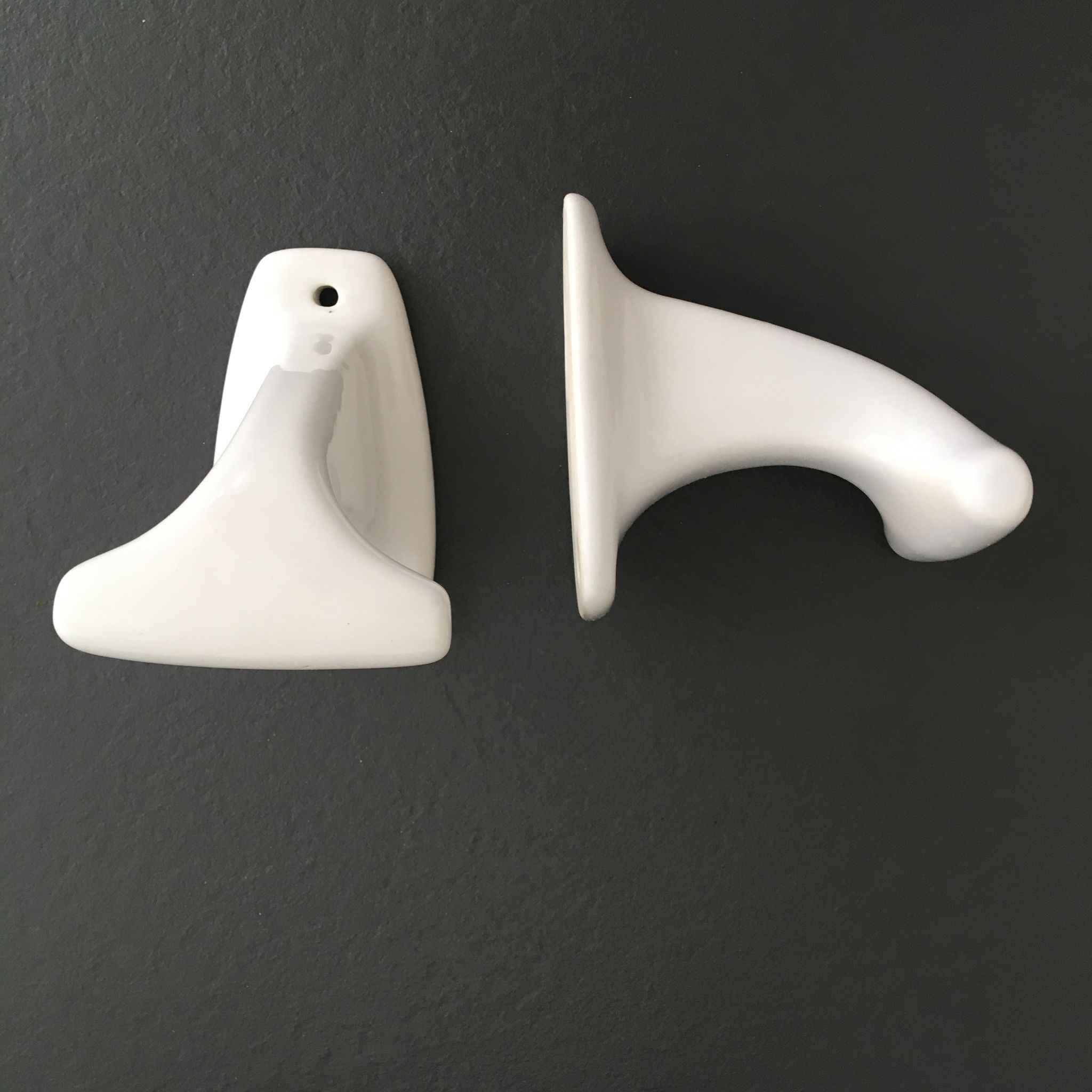 Pair of retro white porcelain hooks