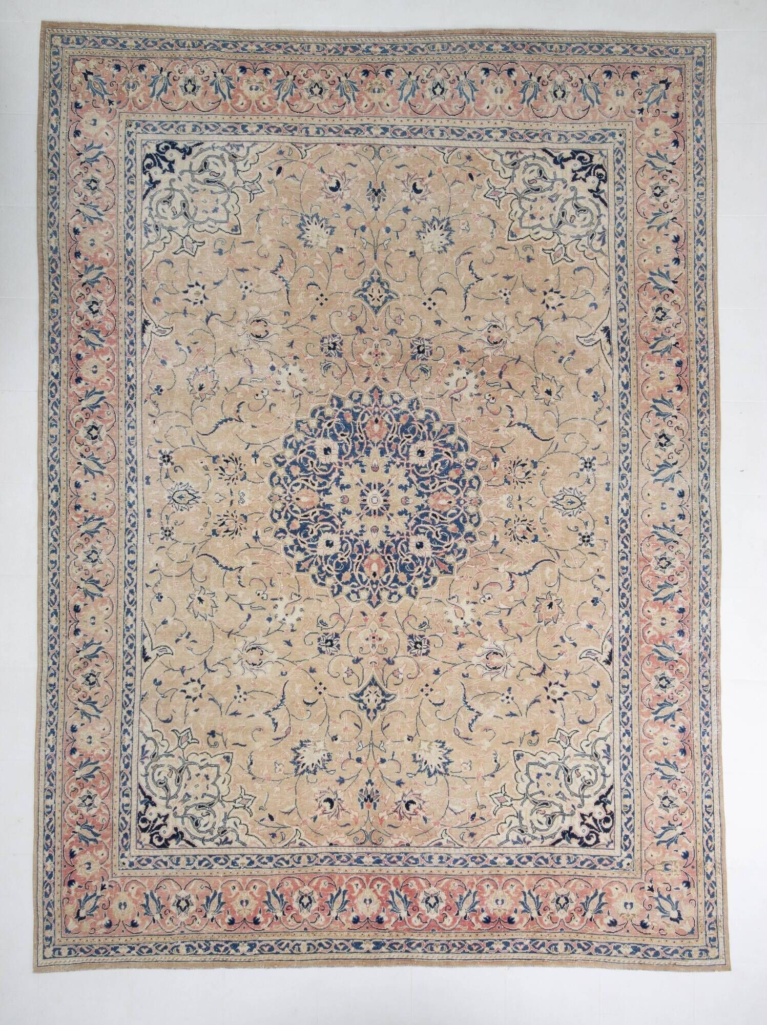 Antique Turkish wool rug in faded floral patterns, 10 x 13 feet.