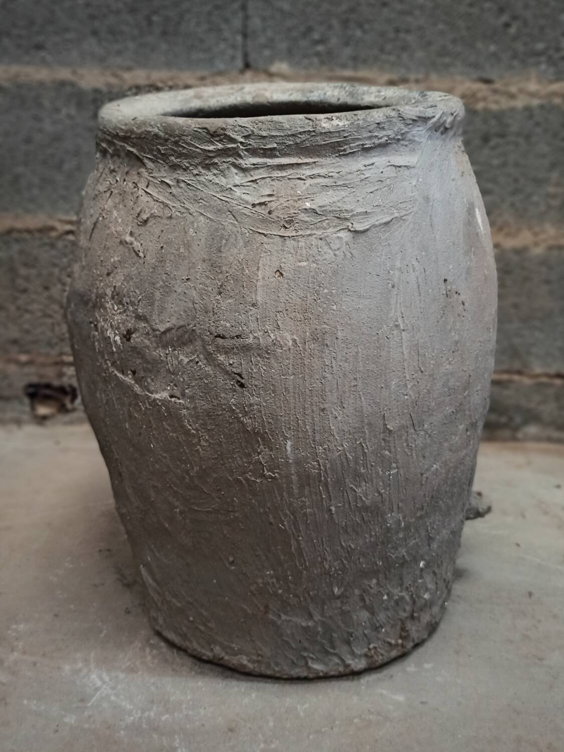 Old gray terracotta pot