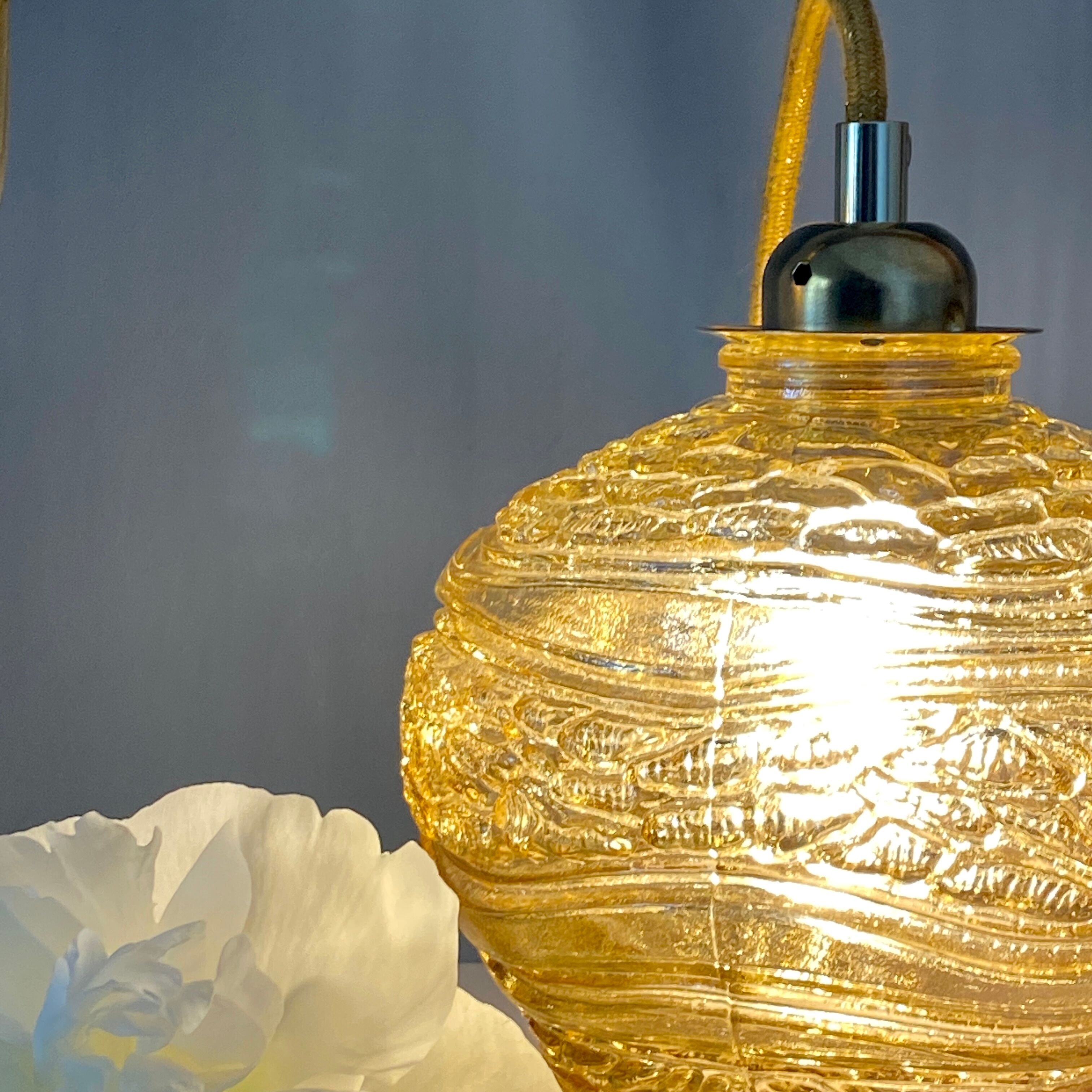 Vintage amber glass globe player