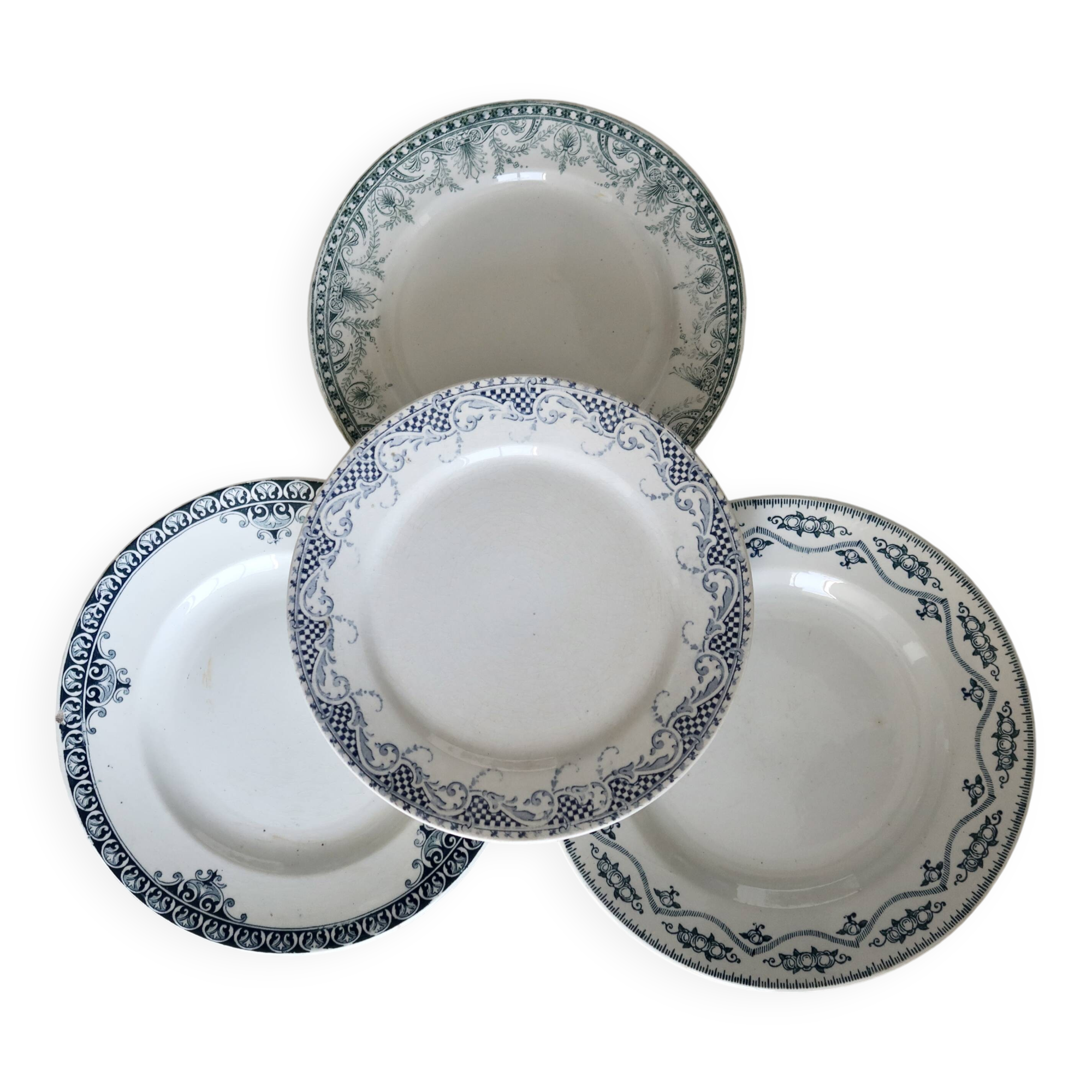 Mismatched vintage flat plates in green and blue ironstone.