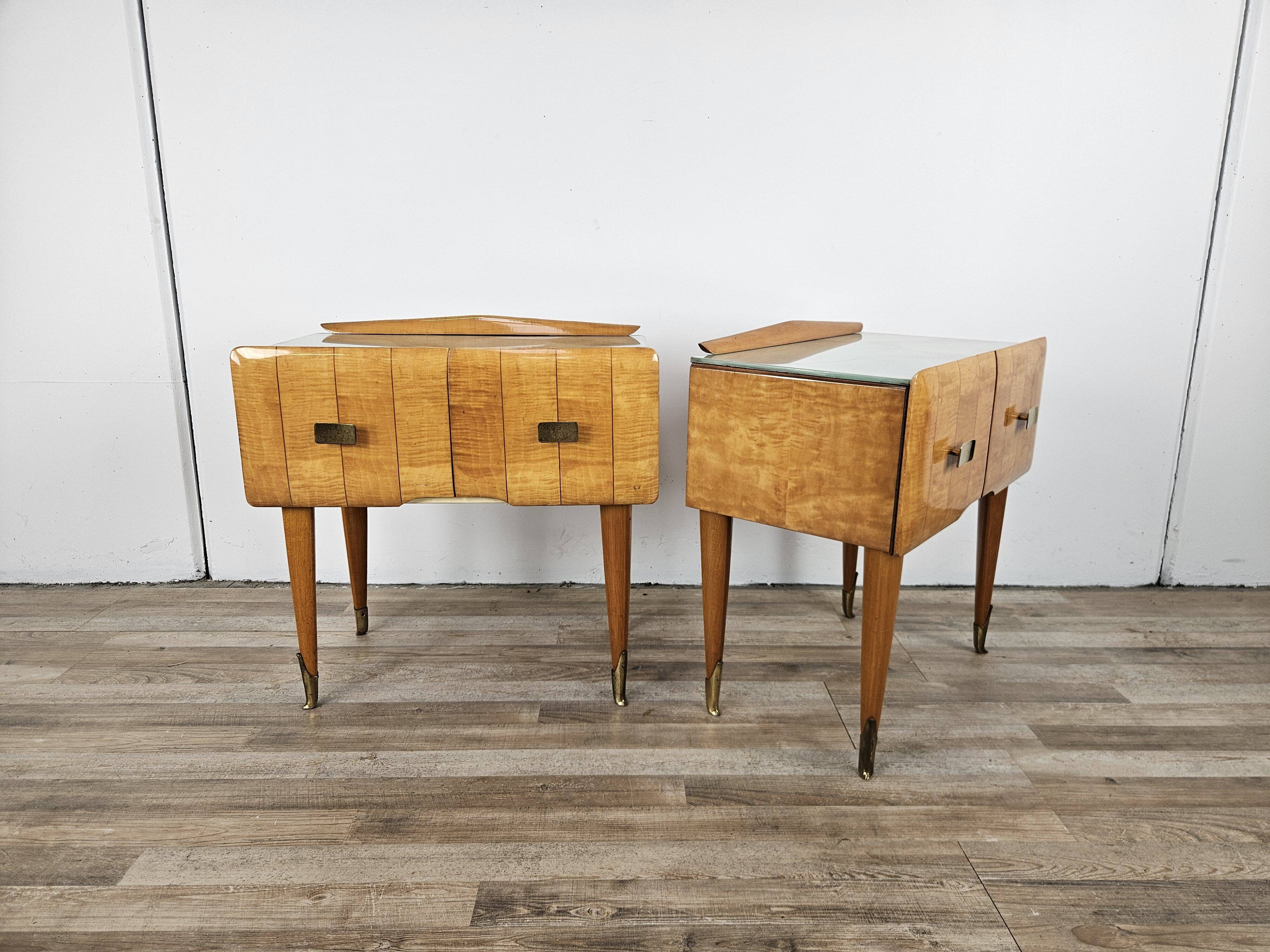 Mid-century nightstands in maple, brass, and glass